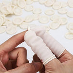 Large size waterproof disposable finger covers spread out on flat surface