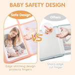 Soft fabric baby memory book opened to show internal photo slots holding family pictures.