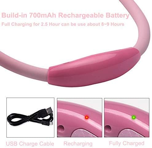 Pink wearable book light being plugged into a universal serial bus port for recharging.