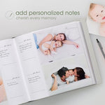 Pearhead polka dot keepsake album displayed on a wooden shelf in a modern neutral nursery setting.