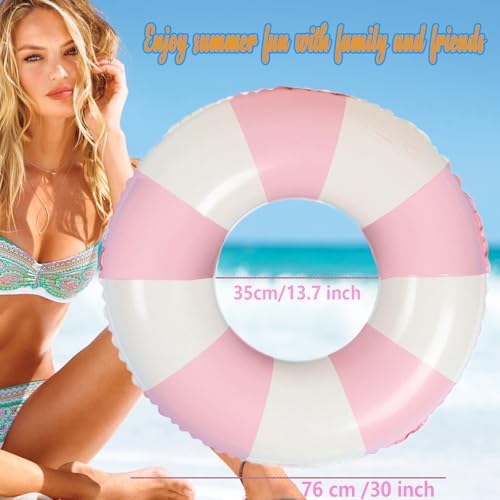 Two pink and white striped swim rings floating in a clear pool
