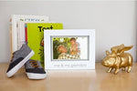 Pearhead Me and My Grandpa frame styled beautifully on a neutral tone nursery shelf next to baby decor pieces.
