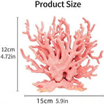 Vibrant pink underwater plant ornament displayed in a clean freshwater aquarium.