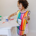 Melissa and Doug kids waterproof apron worn by a toddler during a painting session.