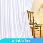 Full wide view of the twenty feet by ten feet white drapes decoration