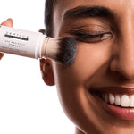 DRMTLGY brand sun protection powder in a portable built-in brush applicator