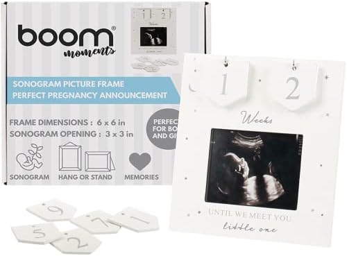 Grey and silver wood sonography photo frame placed on a living room side table.