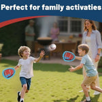 Child using Iplay, Ilearn sticky paddle and ball set outdoors