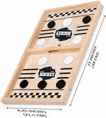 Two players using the premium tabletop string hockey game during a competitive family party match.