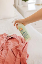 Nellies imported fabric refresher and wrinkle remover bottle close up