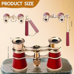 Compact portable red opera glasses folded down for storage