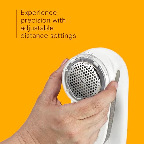 White and gray portable fabric shaver with charging cord