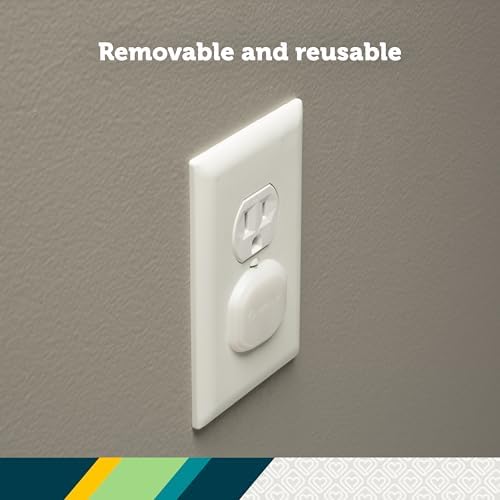 Safety 1st outlet covers installed on a standard wall socket