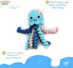 Blue crocheted preemie octopus showing detailed curly tentacles and star accent
