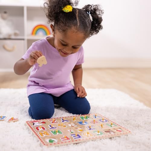 Educational wooden puzzle pieces removed to show matching animal and object illustrations