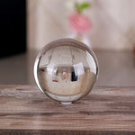 DSJUGGLING transparent manipulation ball balanced on a performer hand demonstrating professional single ball tricks