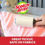 3M Scotch travel size lint remover being held to show compact scale.