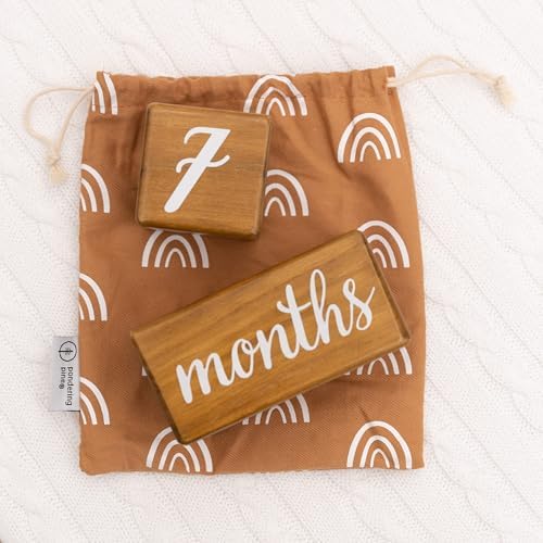 Baby milestone blocks showing weeks months years and grade labels