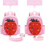 Toddler wearing pink strawberry backpack with adjustable straps