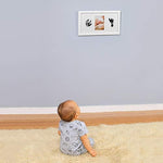 Green Pollywog newborn memory kit accessories including four pieces of acid-free white paper and ink pad.