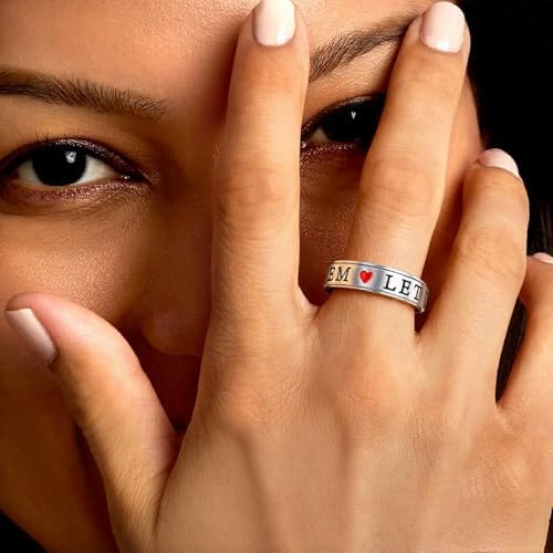 Side angle of the polished silver stainless steel sensory jewelry piece highlighting the dual band construction.