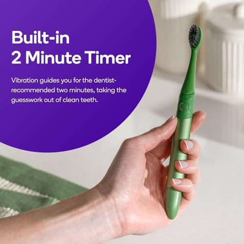 Side view of the ergonomic metallic handle on the professional grade pink power toothbrush.