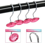 Set of twelve pink crystal decorative bathroom curtain rings on chrome hooks.