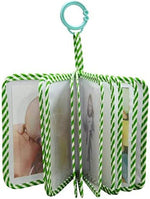 Amzoya fabric baby photo book opened to show clear pockets for four by six pictures