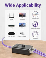 VCELINK RJ45 manual splitter installed beside a desktop computer showcasing its compact size.