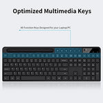 Ergonomic black computer keyboard with a phone and tablet holder slot.