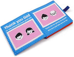 Soft cloth baby prayer book open showing internal photo slots.