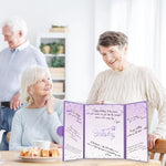 Party table setup with purple birthday sign-in board