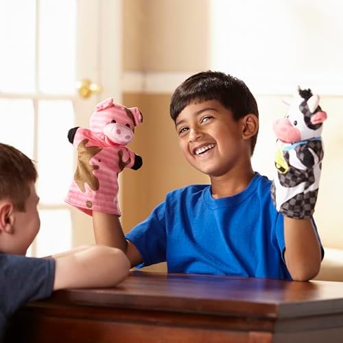 Individual view of the sheep and pig plush hand puppets.