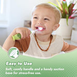 Papablic Max children oral care electric toothbrush with the dinosaur protective cap removed.