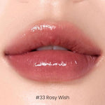 Close up view of the transfer resistant lip gloss formula applied on lips showing the dewy gradient look.