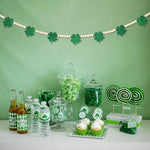 Gistome Irish shamrock beaded banner hanging gracefully across a rustic fireplace mantel.
