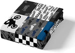Two matching motocross pillowcases with black and grey checked pattern displayed neatly on a bed setup