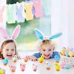 A row of colorful plush Easter bunny and chicken toys ready to hop on a floor surface