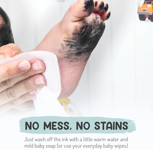 Washing the water-soluble safe black ink off a baby's foot with a soft damp cloth.
