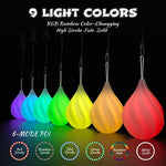 Two count luminous glow pois showcasing the colorful rainbow fade lighting effect in a dark setting.