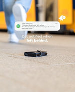 Ultra thin smart tracking card sitting on top of a standard Qi wireless charging pad for a cable free power boost.