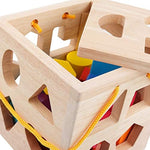 Montessori learning toy showing star and cylinder wooden blocks fitting into side slots.
