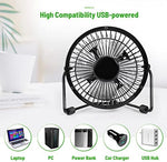 AMKEN small office table fan operating quietly on a wooden workstation setup.