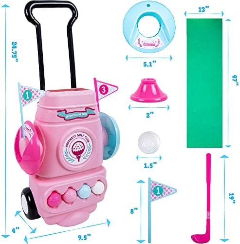 Toddler girl playing with Hapinest pink golf set on putting green