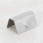 Stainless steel wind deflector retaining clips close up detail