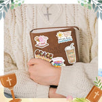 Detailed view of Christian scripture decals and floral artwork
