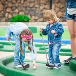 Children playing with Dyienocs retractable toy golf clubs