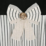 Close up view of the pleated black stripe pattern and wooden button accents on the DOSLY IDÉES shower curtain.