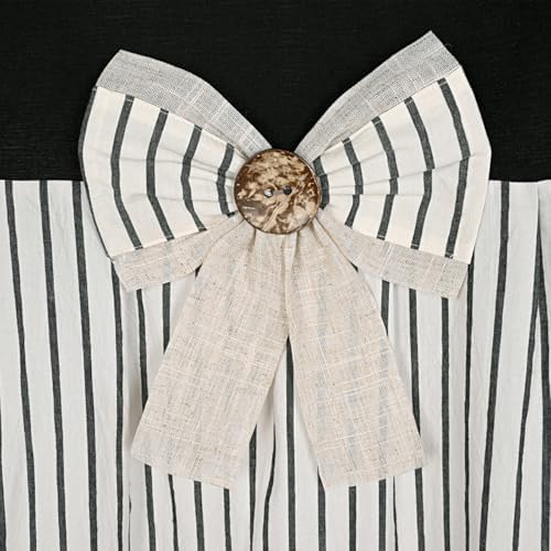 Close up view of the pleated black stripe pattern and wooden button accents on the DOSLY IDÉES shower curtain.