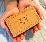 Close up of natural beech wood texture and metal clasp